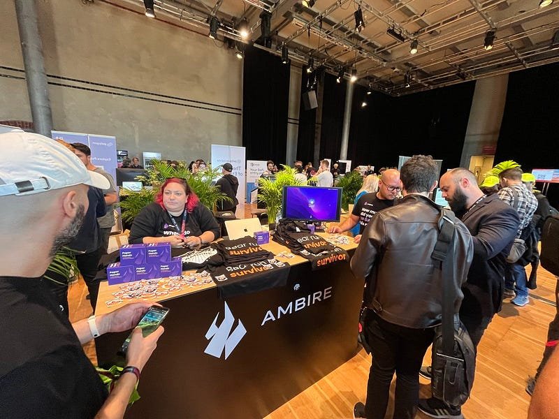 Ambire's team and the Ambire's booth at an event