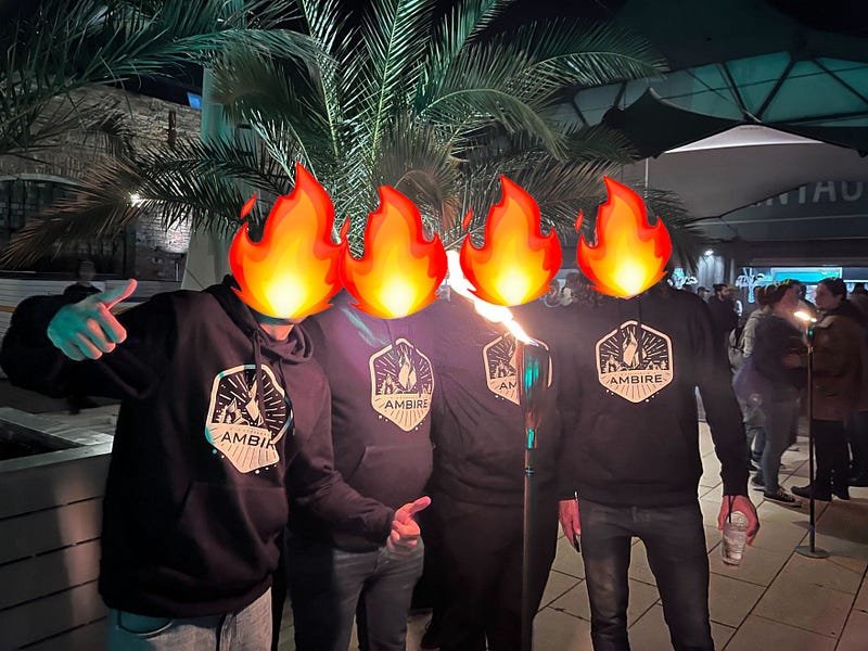 Ambire's team in hoodies and their heads on fire