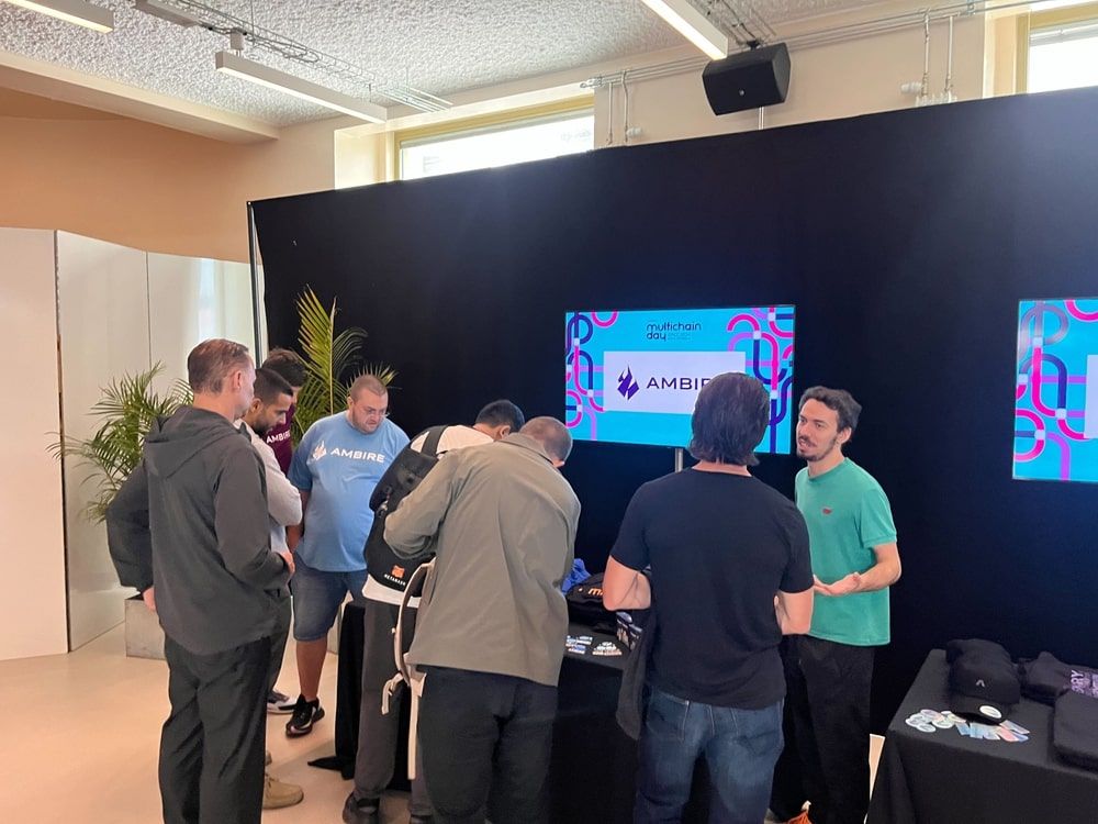 Ambire's booth at Multichain Day with the team members and visitors